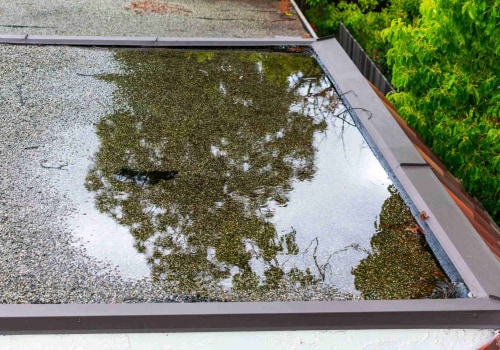 Clearing Debris to Prevent Water Pooling on Flat Roofs